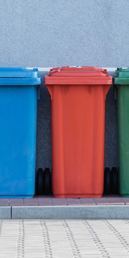 Multi coloured dustbins